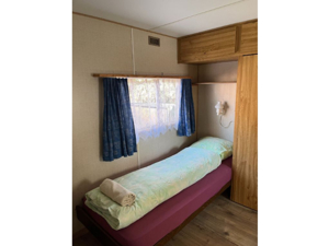 Camping Le Chandelier Chalets & Wohnmobile Schlafzimmer
