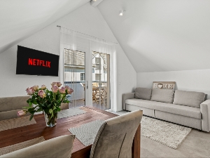 Wohnzimmer in der Dachgeschosswohnung.